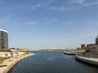 Obraz premium A view of Yas Bay Waterfront and Etihad Arena on Yas Island, Abu Dhabi