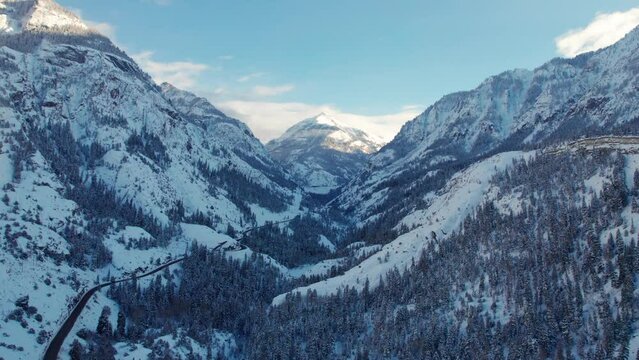 Motivational drone shot of a large mountain framed by two cliffsides