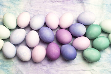 Festive multicolor easter eggs on the tablecloth