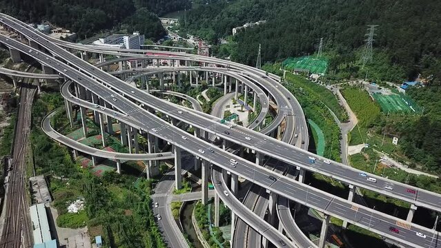 Daytime highway aerial of a big interchange bridge of Chongqing, Huangjuewan, China.