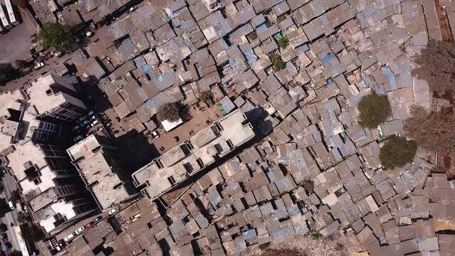 Vertical Aerial Shot of Slums on a Hot Day in Mumbai, India (UHD)