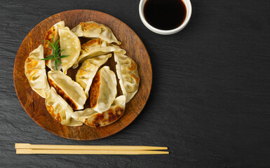 Gyoza Chinese Dumplings on Wood Plate, Fried Vegetable Jiaozi, Chicken Momo Pile, Asian Gyoza Group