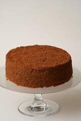 Chocolate honey cake on a white background