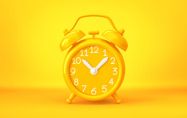 Yellow alarm clock on yellow background