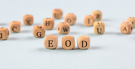 EOD written on a wooden cube , business concept