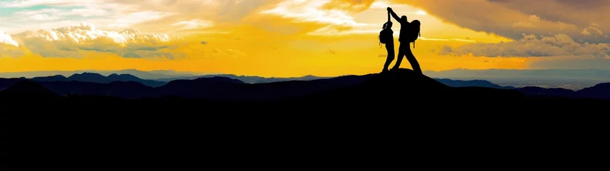 Fotobehang Silhouette of hikers couple mountains forest woods in the morning, landscape panorama, hiking adventure travel success background © Corri Seizinger