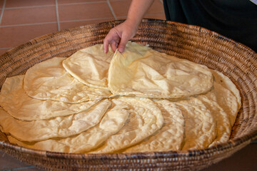 preparation of Sardinian Pane Carasau, Carasau bread, traditional crispy bread of Sardinia, Italy
