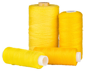 Spools with yellow thread for sewing, craft supply, isolated objects 
