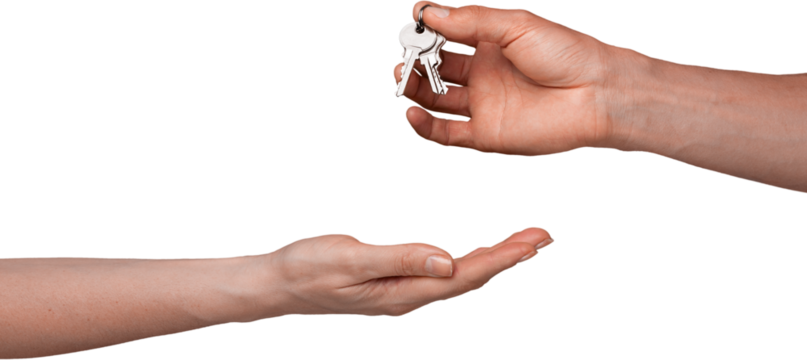 Hand giving house keys isolated on white background