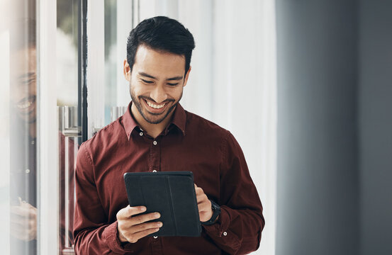 Tablet, window and smile, Indian businessman, happy and reading email or funny social media meme online. Startup office, development and assessment for property design project, architect networking.