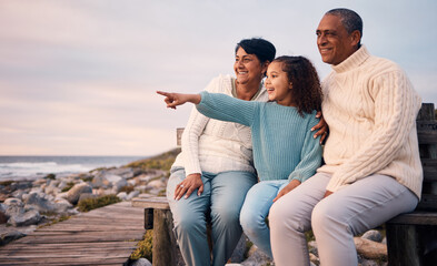 Love, beach and child on vacation with her grandparents sightseeing, bonding and having fun together. Travel, happy and elderly couple in retirement on a seaside holiday with a girl kid in Mexico.