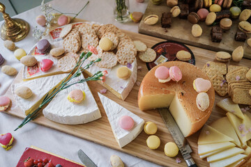 Chees and macaroons on the table, wedding candy bar