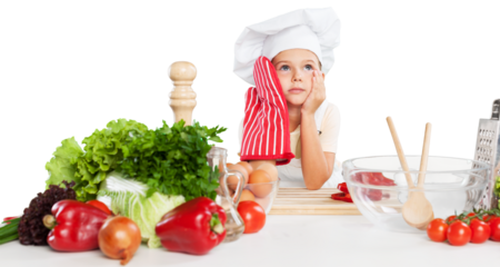 little cute chef holding wooden spoon with different pair of gloves looking at camera and smiling on gray background