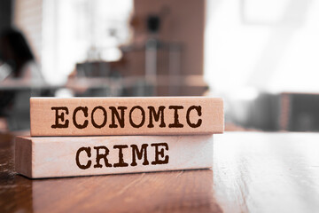 Wooden blocks with words 'ECONOMIC CRIME'.
