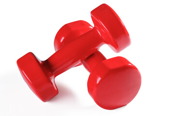 Two red dumbbells isolated on transparent background with shadow.
