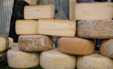 Different types of cheese in France. Market. Outdoor. 