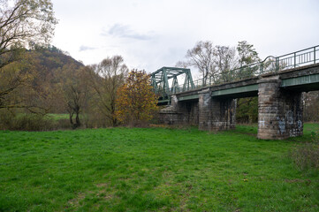 Bridge on the Eder with a green meadow