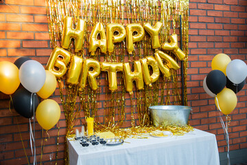 Gold birhday party decoration on the table