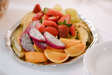 fruit salad with strawberries, oranges and pitaya