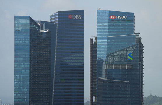The logo sign of multinational companies DBS and HSBC on top of the headquarters office buildings in Singapore, 2023.