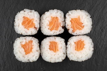 Above ground Japanese sushi food. Maki and rolls with tuna, salmon, shrimp, crab and avocado. Top view of various sushi, all you can eat menu. Rainbow sushi roll, uramaki, hosomaki and nigiri.