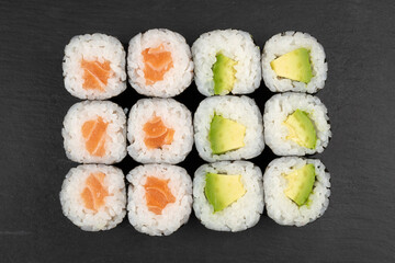 Above ground Japanese sushi food. Maki and rolls with tuna, salmon, shrimp, crab and avocado. Top view of various sushi, all you can eat menu. Rainbow sushi roll, uramaki, hosomaki and nigiri.