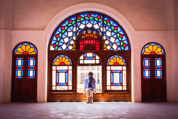 Kashan, Iran - 27th may, 2022: tourist sit in Tabatabaei House built in early 1880s for the affluent Tabatabaei family.
