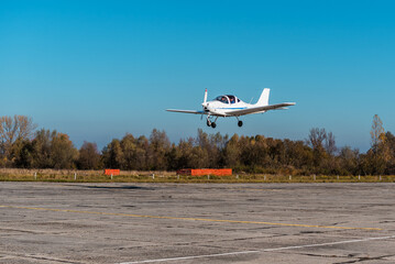 Small private plane in the air. Blue sky. Aviation theme