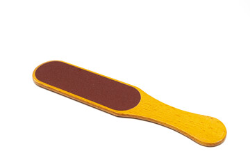 pedicure foot grater with a wooden handle on a white background.