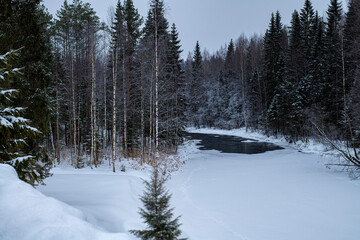 Beautiful snowy mountain park Ruskeala in the Republic of Karelia, Russia in winter. marble quarry