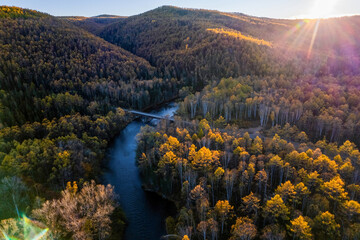 Drone view to autumn forest and small mountain river in the Far East of Russia