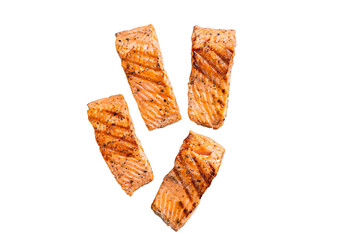Grilled salmon fillets steaks with salt pepper and herb on grill. Isolated, transparent background.