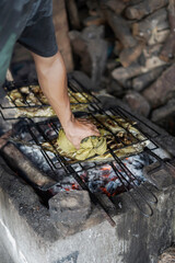 traditional chef grilling fish