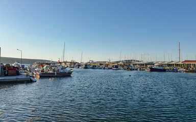 Fototapeta na wymiar fishing boats and yachts in Port Alacati Marina (Cesme, Izmir province, Turkey)