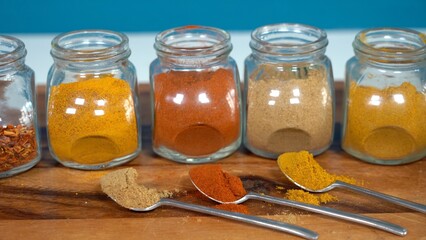 Spices for cooking - Cumin, paprika, curry, turmeric, chilli pepper, pepper, salt, ginger are typical spices of African Moroccan Indian cuisine - health and well-being in  kitchen - Mediterranean diet