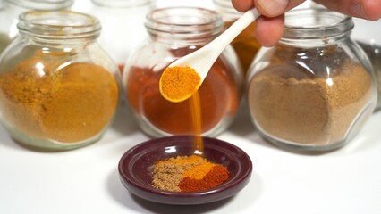 Spices for cooking - Cumin, paprika, curry, turmeric, chilli pepper, pepper, salt, ginger are typical spices of African Moroccan Indian cuisine - health and well-being in  kitchen - Mediterranean diet