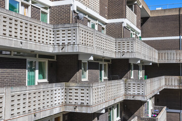 Exterior of Petticoat Square, part of the Middlesex Street Estate in the City of London, featuring slotted concrete balconies