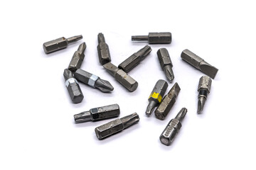 Screwdriver bits, random selection on white background.