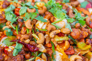 Gai Pad Med Mamuang or Thai Cashew Chicken Kai Med Ma Muang is thai cuisine dish delicious food cooked meal prepared with ingredients. chicken meat, capsicum, onion, scallions, chilli. Thai Food.