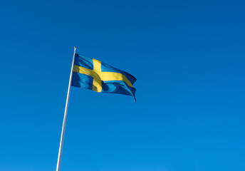 Swedish flag banner waving on sunny day 