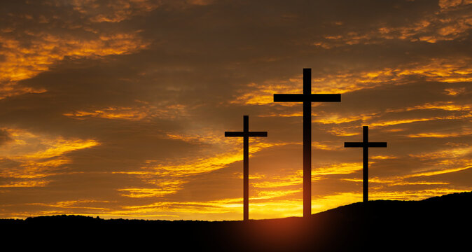 Christian crosses on hill outdoors at sunrise. Resurrection of Jesus. Concept photo.