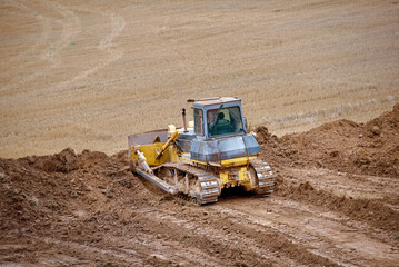 Dozer leveling ground, construction work. Land leveling bulldozer, earthmoving on construction...