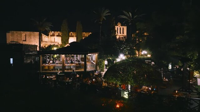 People enjoy dinner at Bellapais Monastery, North Cyprus