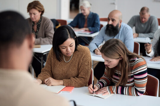 Group of adults sitting in class