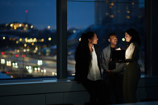 Colleagues working late in office