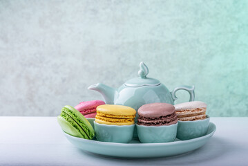 Sweet delicate multi-colored macaroni cakes on the table.