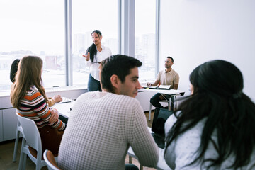 Woman giving presentation at seminar