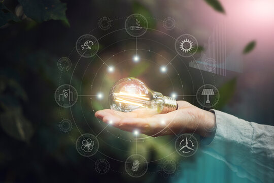 Illuminated lightbulb on hand