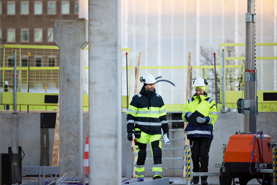 Construction engineers working at construction site