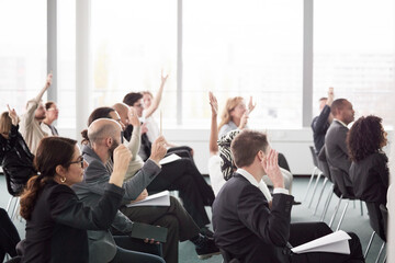 Business people sitting during seminar